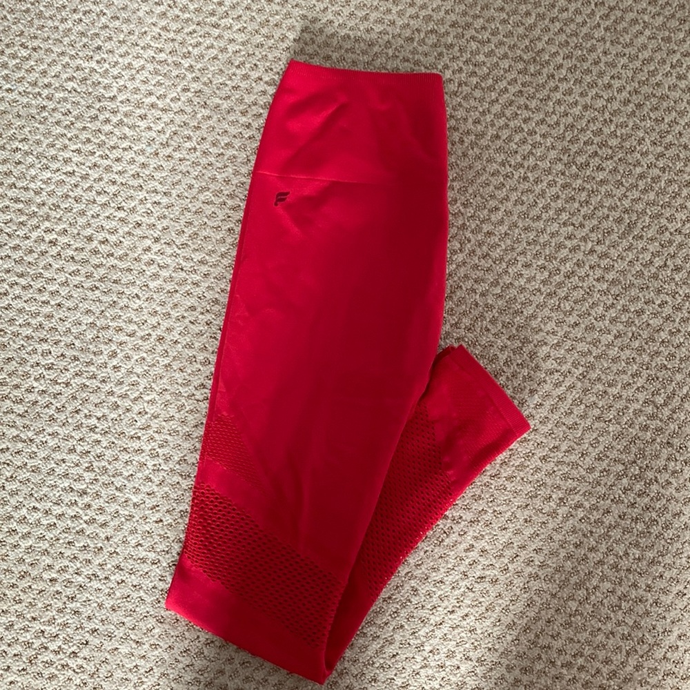 These are Fabletics leggings in size XS and the color red.